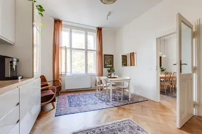 a kitchen and living room with a table and chairs at Prague Heart of Old Town Comfy Home 2BDR 2BATH in Prague