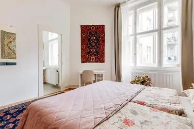 a bedroom with a large bed and a window at Prague Heart of Old Town Comfy Home 2BDR 2BATH in Prague
