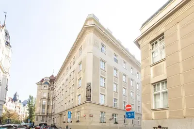 a large building on a city street with buildings at Prague Heart of Old Town Comfy Home 2BDR 2BATH in Prague