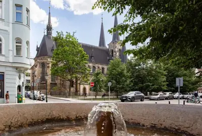 a fountain in the middle of a city with a building at Prague Old Town Residence in Prague