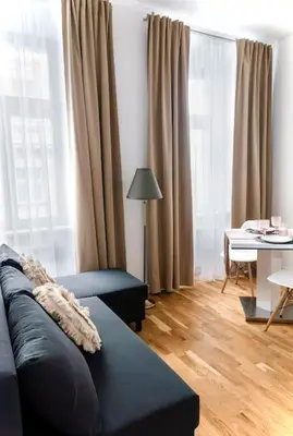 a living room with a couch and a table at Prague Old Town Residence in Prague
