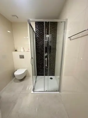 a shower stall in a bathroom with a toilet at Prague Old Town Residence in Prague