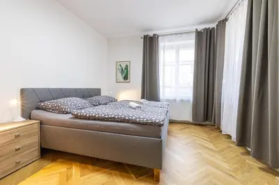 a bedroom with a bed and a window at Spoon Apartment Prague 1A in Prague