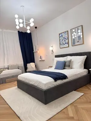 a bedroom with a large bed in a room at Rentero National Theatre Apartment with 2 Bathrooms Prague City Center in Prague
