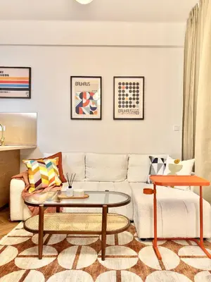 a living room with a couch and a table at Rentero National Theatre Apartment with 2 Bathrooms Prague City Center in Prague