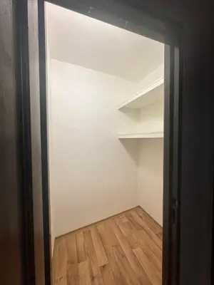 an open door to a room with a closet at Budget Dlouha Apartment in Prague