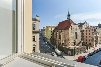 a view of a city street from a window at Premiere Dubcek Apartment in Prague