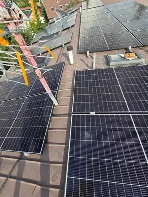 a group of solar panels on top of a roof at Hotel Jahodnice in Prague