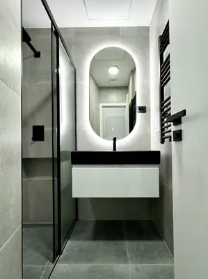 a bathroom with a sink and a mirror at Rentero modern Apartment, 10 minutes Charles bridge, Prague in Prague