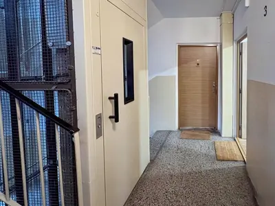 a hallway with a door leading to a room with a door at Jana's WOW apt, 3 room, free parking, 15'Airpt, 25'City in Prague