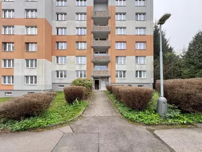 a walkway in front of a tall building at Jana's WOW apt, 3 room, free parking, 15'Airpt, 25'City in Prague