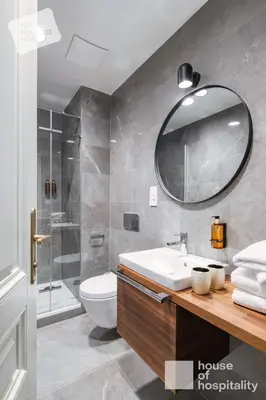 a bathroom with a sink and a toilet and a mirror at MY SECOND HOME by House of Hospitality in Prague
