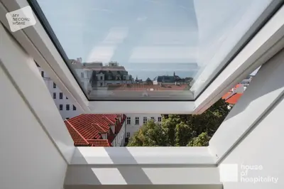a view of the city from inside a building at MY SECOND HOME by House of Hospitality in Prague