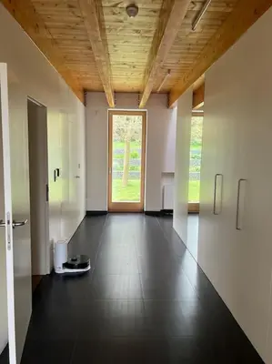 a room with a hallway with a door and a window at Klokočná in Klokočná