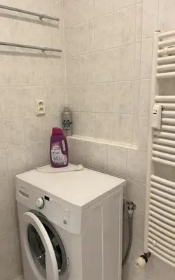 a washing machine with a pink appliance on top of it at Praha 5 Barrandov- Apartmán Daniela in Prague