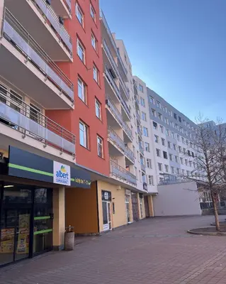 an empty street in front of a large building at Praha 5 Barrandov- Apartmán Daniela in Prague