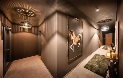 a hallway with a painting of a horse on the wall at Wenceslas sq SOHO Boutique Hotel & Premium Suites in Prague