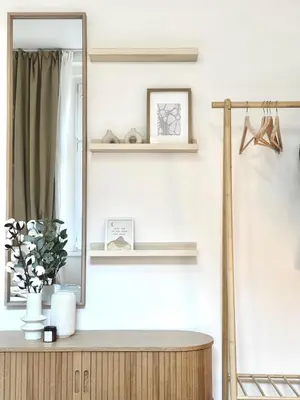 a bathroom with a mirror and a wooden dresser at Rentero Golden Wabi-Sabi Apartment, Prague in Prague