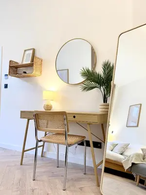 a dressing room with a desk and a mirror at Rentero Golden Wabi-Sabi Apartment, Prague in Prague