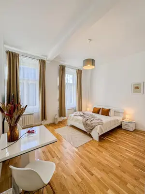 a living room with a bed and a table at TurnKey I Wenceslas Square Apartments in Prague