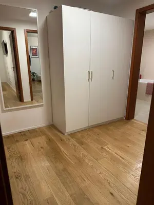 a room with a white cabinet and a mirror at Pasta Party Apartment, Free Parking, Fully Equipped in Prague