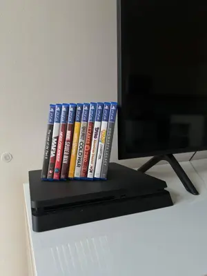 a row of books sitting on top of a desk at Pasta Party Apartment, Free Parking, Fully Equipped in Prague