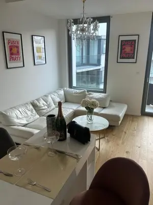 a living room with a couch and a table with wine glasses at Pasta Party Apartment, Free Parking, Fully Equipped in Prague
