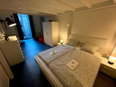 a bedroom with a bed with a plate on it at Opletalova Residence 1min from Wenceslas Square in Prague