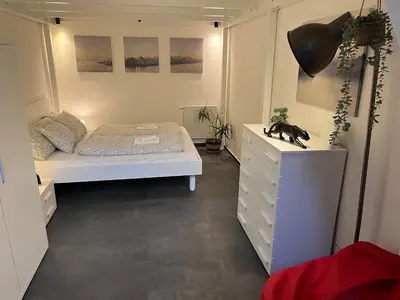 a small bedroom with a bed and a dresser at Opletalova Residence 1min from Wenceslas Square in Prague