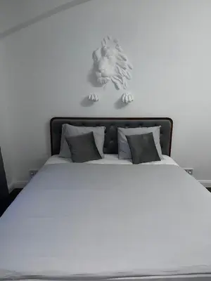 a bedroom with a white bed with two pillows at Saint Petr in Prague