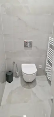 a bathroom with a white toilet in a room at Saint Petr in Prague
