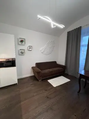 a living room with a couch and a table at Saint Petr in Prague