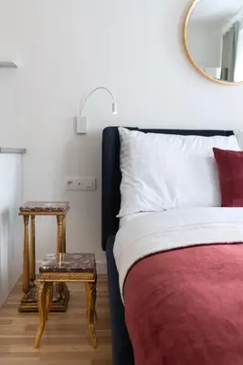 a bedroom with a bed and a side table at J3 Prague Apartments in Prague