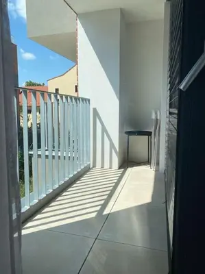 a balcony with a table on the side of a building at Quiet apartment near Prague centre in Prague