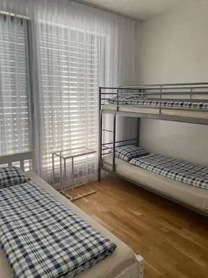 two bunk beds in a room with a window at Quiet apartment near Prague centre in Prague