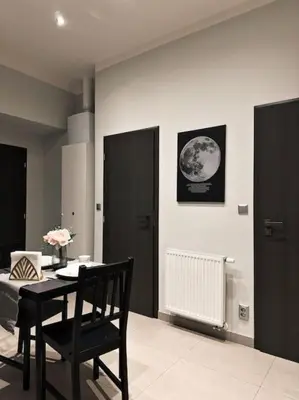 a room with a table and a black chair at Château Étoile Loft - PRG Centre in Prague