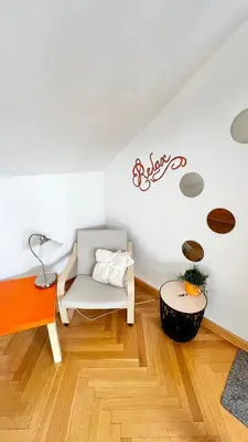 a living room with a couch and a table at Miru Loft Prague in Prague