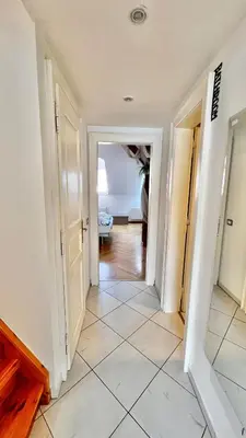 a hallway in a house with a hallway leading into a room at Miru Loft Prague in Prague