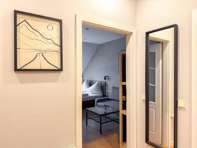 a hallway leading to a room with a living room at Radost Residence The Heart of Unique Living in Prague