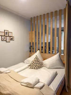 a bedroom with two beds with pillows at Radost Residence The Heart of Unique Living in Prague