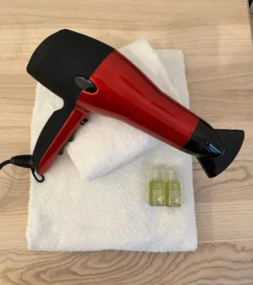 a red stapler on top of a white towel at Historic Centre Apartments V in Prague
