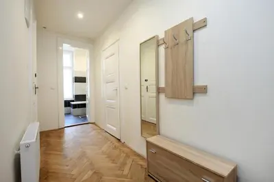 a room with a hallway with a mirror and a door at Historic Centre Apartments V in Prague