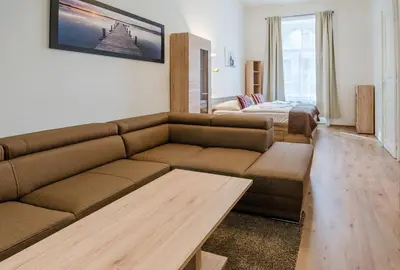 a living room with a couch and a bed at Historic Centre Apartments V in Prague