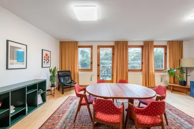 a living room with a table and chairs at Bliss Apartment in Prague