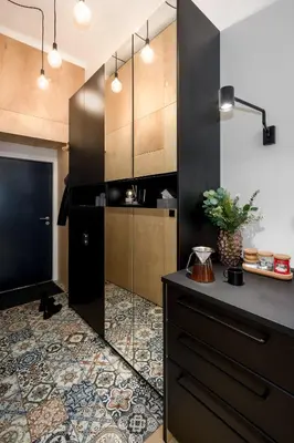 a kitchen with black cabinets and a floor at Prague Days - Family-friendly Apartment with high speed Wi-Fi and Netflix in Prague