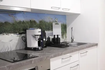 a kitchen with a coffee maker on a counter at Elegant Apartment in Wenceslas Square in Prague