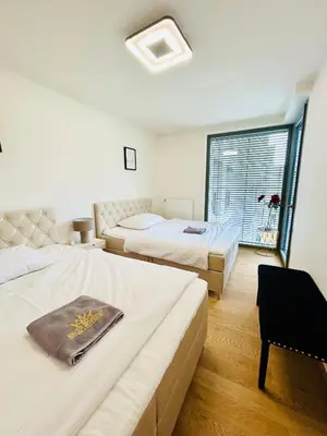 a hotel room with two beds and a window at New Luxury Apartmen at Andel Metro Station in Prague