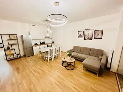 a living room with a couch and a table at New Luxury Apartmen at Andel Metro Station in Prague