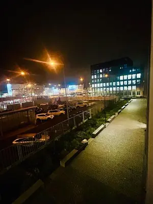 a view of a parking lot at night at New Luxury Apartmen at Andel Metro Station in Prague