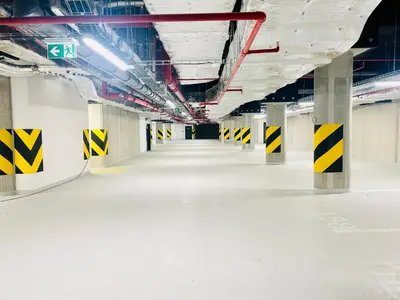 an empty hallway in a building with yellow and white floors at New Luxury Apartmen at Andel Metro Station in Prague